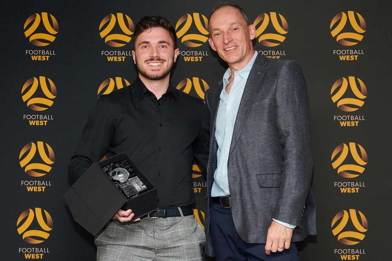 Men's State League Division Two Player of the Year Sasa Njegic of Dianella White Eagles receives his award from Football West director David Buckingham. Photo by Football West/FotoEnzo