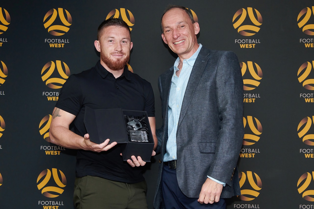 Men's State League Division One Player of the Year John Baird of Mandurah City receives his award from Football West Board member David Buckingham. Photo by Football West/FotoEnzo